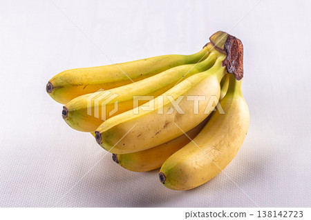 Fresh bunch of ripe yellow bananas isolated on a white background 138142723