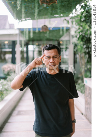 Angry man shouting with aggressive expression in outdoor setting Angry man shouting with aggressive expression in outdoor setting 138142814