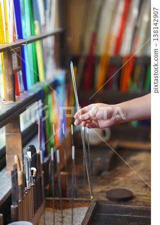 Image of hands working in a colorful workshop 138142907