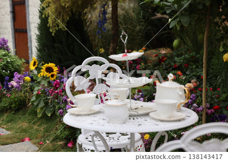 March 21 2026 Elegant white tea set on table in garden 138143417