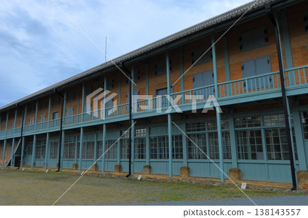Exterior view of the East Cocoon Warehouse at Tomioka Silk Mill, a World Heritage Site, in a deserted spring landscape, Tomioka City, Gunma Prefecture. Exterior view of the East Cocoon Warehouse at Tomioka Silk Mill, a World Heritage Site, in a deserted spring landscape, Tomioka City, Gunma Prefecture. 138143557