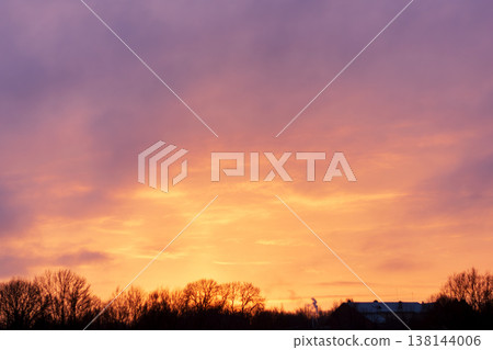 Stunning natural phenomenon: Golden hour sky in fiery orange and vibrant violet tones Stunning natural phenomenon: Golden hour sky in fiery orange and vibrant violet tones 138144006