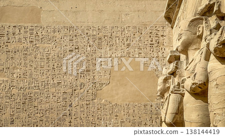 Beautiful bas-reliefs and ancient hieroglyphs from the mortuary temple of Ramesses III at Medinet Habu, Luxor, Egypt. Beautiful bas-reliefs and ancient hieroglyphs from the mortuary temple of Ramesses III at Medinet Habu, Luxor, Egypt. 138144419