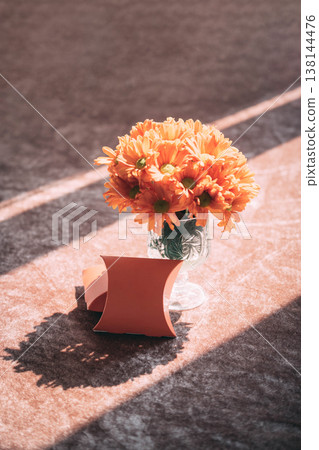 Blank Wedding Favor Box Mockup with Orange Flowers and Natural Sunlight Shadow Blank Wedding Favor Box Mockup with Orange Flowers and Natural Sunlight Shadow 138144476