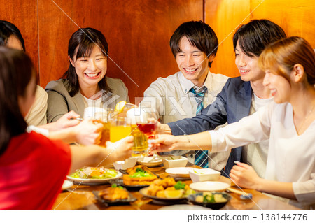 A man toasting in a pub A man toasting in a pub 138144776