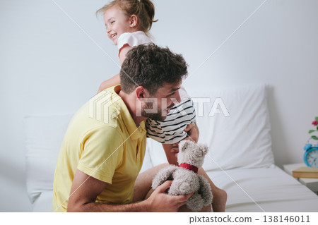 Father reading story to his daughter Father reading story to his daughter 138146011