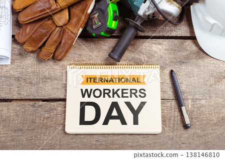 Celebrating international workers day with tools and equipment on a wooden surface 138146810