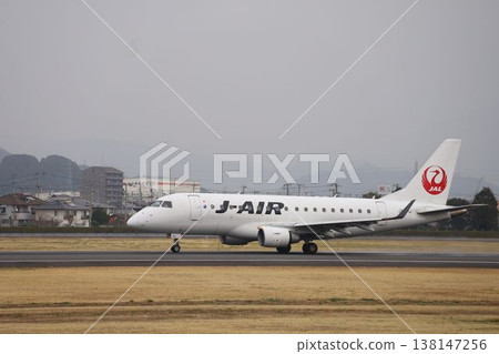 A J-Air plane taking off from Matsuyama Airport A J-Air plane taking off from Matsuyama Airport 138147256