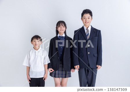 Three children standing side by side Three children standing side by side 138147309
