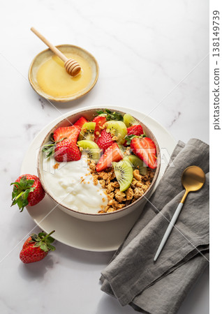 Healthy yogurt bowl with granola and fresh berries for clean eating diet Healthy yogurt bowl with granola and fresh berries for clean eating diet 138149739