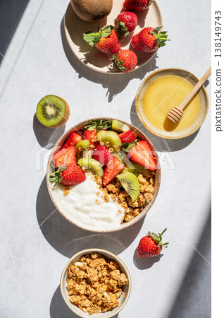 Balanced breakfast with yogurt, granola and fruits, top view Balanced breakfast with yogurt, granola and fruits, top view 138149743