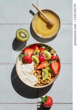 Balanced breakfast with yogurt, granola and fruits, top view Balanced breakfast with yogurt, granola and fruits, top view 138149744