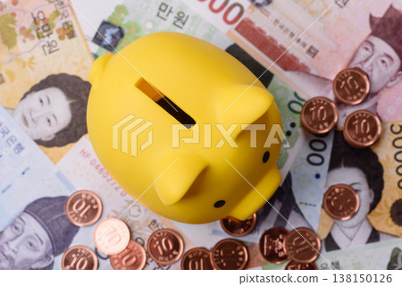A piggy bank as a concept for storing, accumulating, and saving financial resources. A piggy bank A piggy bank as a concept for storing, accumulating, and saving financial resources. A piggy bank 138150126