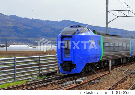 Kiha 281 series Super Hokuto train exterior | Hokkaido's peaceful rural landscape and mountain range Kiha 281 series Super Hokuto train exterior | Hokkaido's peaceful rural landscape and mountain range 138150532