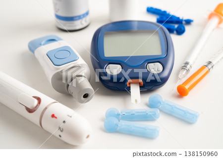 Glucometer lancet and test stick measuring human blood sugar level for diabetes. Glucometer lancet and test stick measuring human blood sugar level for diabetes. 138150960