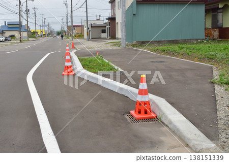 A sidewalk that has been widened in only a portion A sidewalk that has been widened in only a portion 138151339
