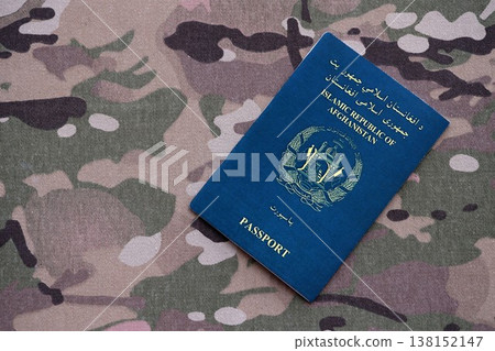 Afghan passport on table close up. Official identification document book for citizens of Afghanistan. Concept of travel and tourism 138152147
