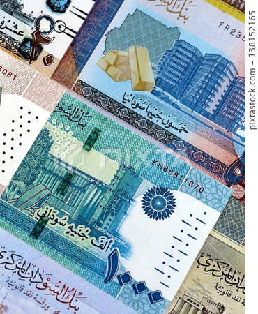 Sudanese pound paper banknotes pile on table. Sudan SDG currency money bills in big amount. Concept of economics, taxation and banking in Sudan Sudanese pound paper banknotes pile on table. Sudan SDG currency money bills in big amount. Concept of economics, taxation and banking in Sudan 138152165