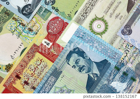 Iraqi dinar paper banknotes pile on table. Iraq IQD currency money bills in big amount. Concept of economics, taxation and banking in Iraq 138152167