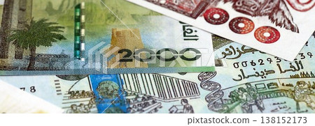 Algerian dinar paper banknotes pile on table. Algeria DZD currency money bills in big amount. Concept of economics, taxation and banking in Algeria Algerian dinar paper banknotes pile on table. Algeria DZD currency money bills in big amount. Concept of economics, taxation and banking in Algeria 138152173