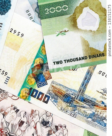 Algerian dinar paper banknotes pile on table. Algeria DZD currency money bills in big amount. Concept of economics, taxation and banking in Algeria 138152175