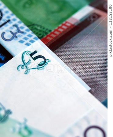 Gibraltar pound paper banknotes pile on table. Gibraltar GIP currency money bills in big amount. Concept of economics, taxation and banking in Gibraltar Gibraltar pound paper banknotes pile on table. Gibraltar GIP currency money bills in big amount. Concept of economics, taxation and banking in Gibraltar 138152190