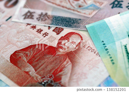 Taiwanese dollar paper banknotes pile on table. Taiwan TWD currency money bills in big amount. Concept of economics, taxation and banking in Taiwan 138152201
