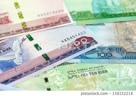 Ethiopian birr paper banknotes pile on table. Ethiopia ETB currency money bills in big amount. Concept of economics, taxation and banking in Ethiopia Ethiopian birr paper banknotes pile on table. Ethiopia ETB currency money bills in big amount. Concept of economics, taxation and banking in Ethiopia 138152218