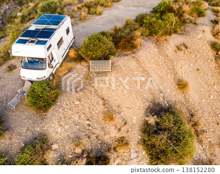 Caravan with solar panels on roof on sea, Spain. Aerial view. Caravan with solar panels on roof on sea, Spain. Aerial view. 138152280