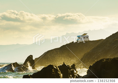 Seaside view with caravan camping on cliff 138152308