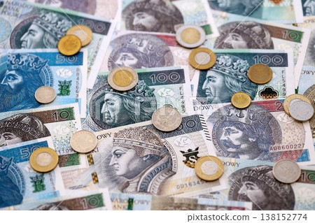 Big amount of polish zloty money banknotes and grosz coins close up. Huge pile of cash of Poland currency. Concept of business, economy and investment in Poland Big amount of polish zloty money banknotes and grosz coins close up. Huge pile of cash of Poland currency. Concept of business, economy and investment in Poland 138152774
