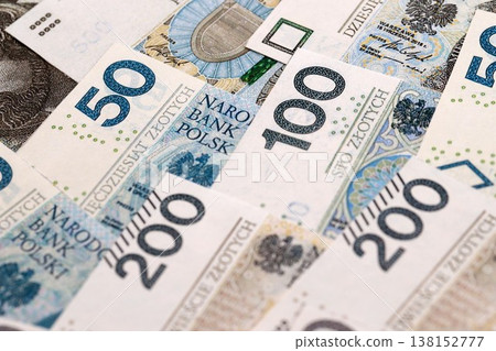 Big amount of polish zloty money bills banknotes close up. Huge pile of cash of Poland currency. Concept of business, economy and investment in Poland Big amount of polish zloty money bills banknotes close up. Huge pile of cash of Poland currency. Concept of business, economy and investment in Poland 138152777