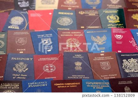 Big amount of passports of various different countries. Covers of expired passports close up. Travel documents for tourism 138152809