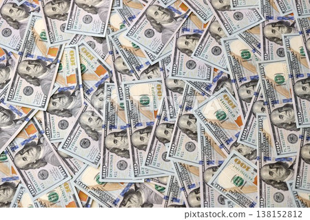 Big pile of new USD hundred dollar bills. Currency of United States of America in big amount. US one hundred bucks banknotes. Rich life concept, business and economy 138152812