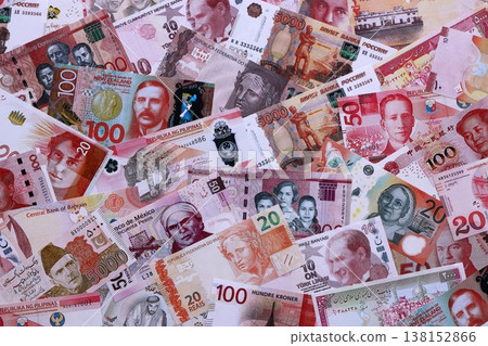 Various currencies money bills banknotes in red color. Many cash bills from different countries in big pile close up. World economy and currency exchange concept Various currencies money bills banknotes in red color. Many cash bills from different countries in big pile close up. World economy and currency exchange concept 138152866