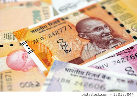 Big pile of Indian Rupees money bills banknotes close up. Lots of money of Indian INR currency cash in big bunch. Economics and business in India Big pile of Indian Rupees money bills banknotes close up. Lots of money of Indian INR currency cash in big bunch. Economics and business in India 138153044