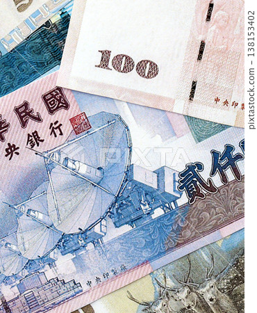 Taiwanese dollar paper banknotes pile on table. Taiwan TWD currency money bills in big amount. Concept of economics, taxation and banking in Taiwan Taiwanese dollar paper banknotes pile on table. Taiwan TWD currency money bills in big amount. Concept of economics, taxation and banking in Taiwan 138153402