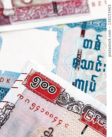 Myanmar kyat paper banknotes pile on table. Myanmar MMK currency money bills in big amount. Concept of economics, taxation and banking in Myanmar 138153403