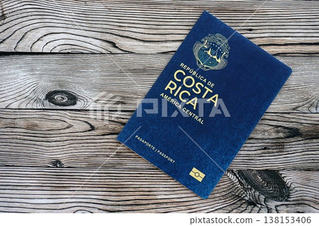 Costa Rican passport on table close up. Official identification document book for citizens of Costa Rica. Concept of travel and tourism in Costa Rica Costa Rican passport on table close up. Official identification document book for citizens of Costa Rica. Concept of travel and tourism in Costa Rica 138153406
