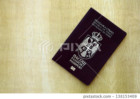 Serbian passport on table close up. Official identification document book for citizens of Serbia. Concept of travel and tourism in Serbia Serbian passport on table close up. Official identification document book for citizens of Serbia. Concept of travel and tourism in Serbia 138153409
