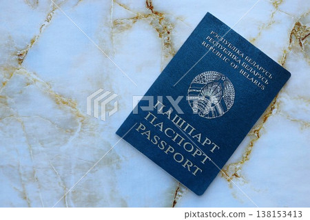 Belarusian passport on table close up. Official identification document book for citizens of Belarus. Concept of travel and tourism in Belarus Belarusian passport on table close up. Official identification document book for citizens of Belarus. Concept of travel and tourism in Belarus 138153413