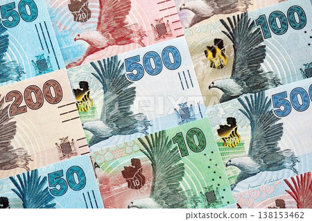 Zambian kwacha money bills pile on table. Zambia banknotes of ZMW currency close up. Concept of business, economy and banking in Zambia Zambian kwacha money bills pile on table. Zambia banknotes of ZMW currency close up. Concept of business, economy and banking in Zambia 138153462
