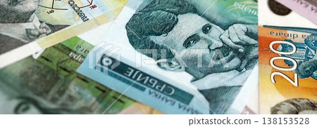 Serbian dinar money bills pile on table. Serbia banknotes of RSD currency close up. Concept of business, economy and banking in Serbia 138153528
