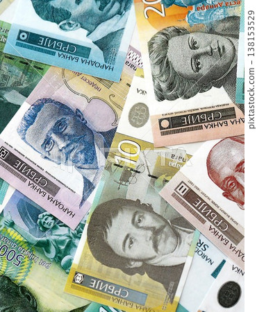 Serbian dinar money bills pile on table. Serbia banknotes of RSD currency close up. Concept of business, economy and banking in Serbia 138153529