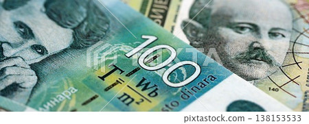 Serbian dinar money bills pile on table. Serbia banknotes of RSD currency close up. Concept of business, economy and banking in Serbia 138153533
