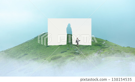 Woman walking on mountain path through paper human silhouette cutout in fog. 138154535