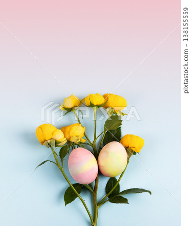 Colorful Easter eggs with a sprig of yellow roses on a blue pink gradient background. Happy Easter concept. Greeting card, copy space Colorful Easter eggs with a sprig of yellow roses on a blue pink gradient background. Happy Easter concept. Greeting card, copy space 138155559