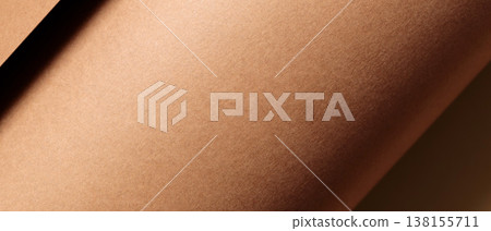 Abstract brown paper texture with diagonal shadow and warm natural lighting Abstract brown paper texture with diagonal shadow and warm natural lighting 138155711
