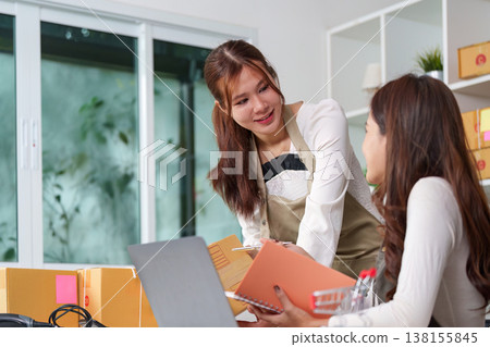 Small business owners managing e-commerce operations Small business owners managing e-commerce operations 138155845