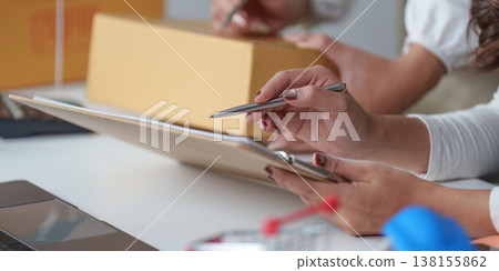 Small business team preparing packages for shipment Small business team preparing packages for shipment 138155862